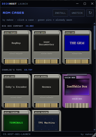 The Deck Host launcher in a dark style, with ROM cases for Big Box Company and Charlie’s Toys.